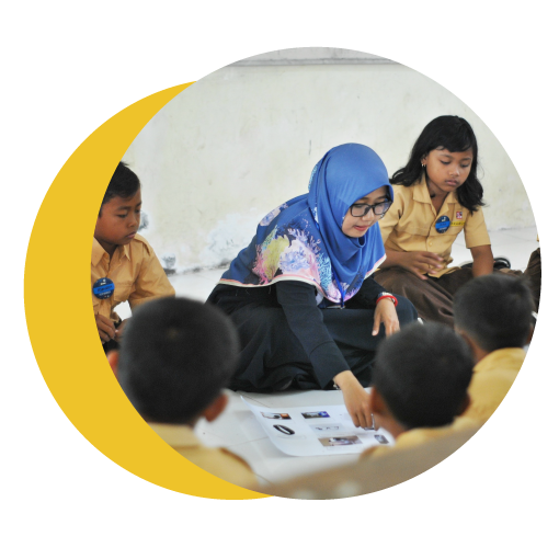 Woman teaching a primary school class