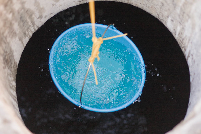 water in a bucket from a well